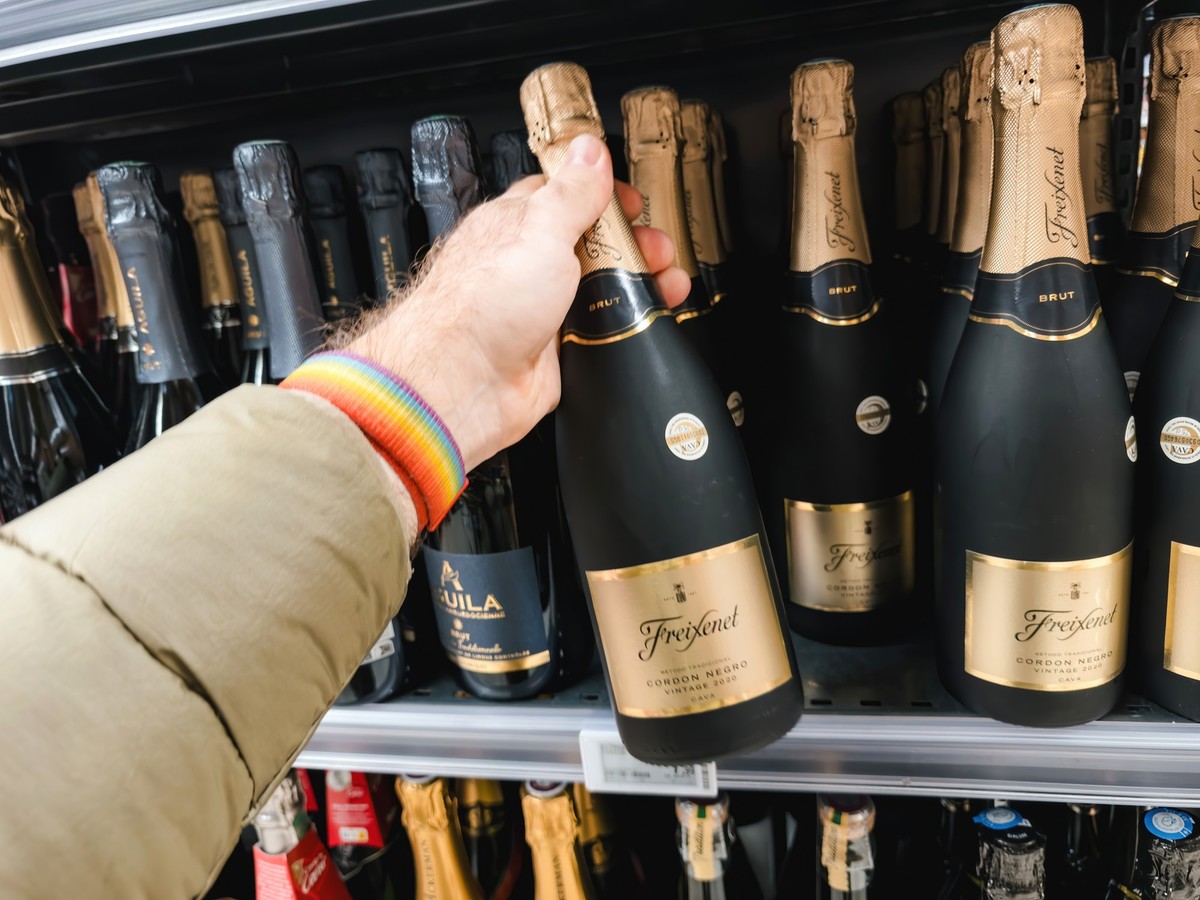Paris, France - Nov 10, 2023: A POV perspective captures a customer reaching for a bottle of Freixenet champagne from the shelves, preparing for an upcoming holiday anniversary and special occasion Mo ...