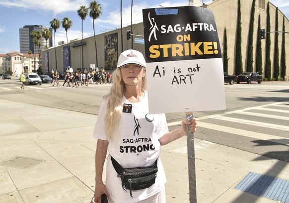 FILE - Frances Fisher appears on a picket line outside Warner Bros. studios on Wednesday, July 26, 2023, in Burbank, Calif. Saturday marks the 100th day that film and TV performers from the Screen Act ...