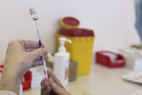 epa09667825 A medical staff prepares doses of the Covid-19 Pfizer vaccine for the vaccination for children between 5 - 11 year old at the vaccination center of the Geneva University Hospitals (HUG), i ...