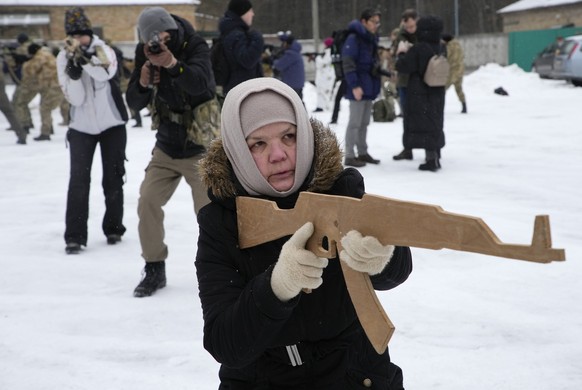 FILE Rumia, 59, a member of Ukraine&#039;s Territorial Defense Forces, trains close to Kyiv, Ukraine, Saturday, Feb. 5, 2022. Hundreds of civilians have been joining Ukraine&#039;s army reserves in re ...