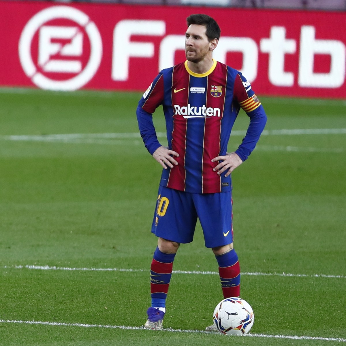 Barcelona's Lionel Messi waits in the centre circle to restart the match after Valencia scored the opening goal of the game during the Spanish La Liga soccer match between Barcelona and Valencia  ...