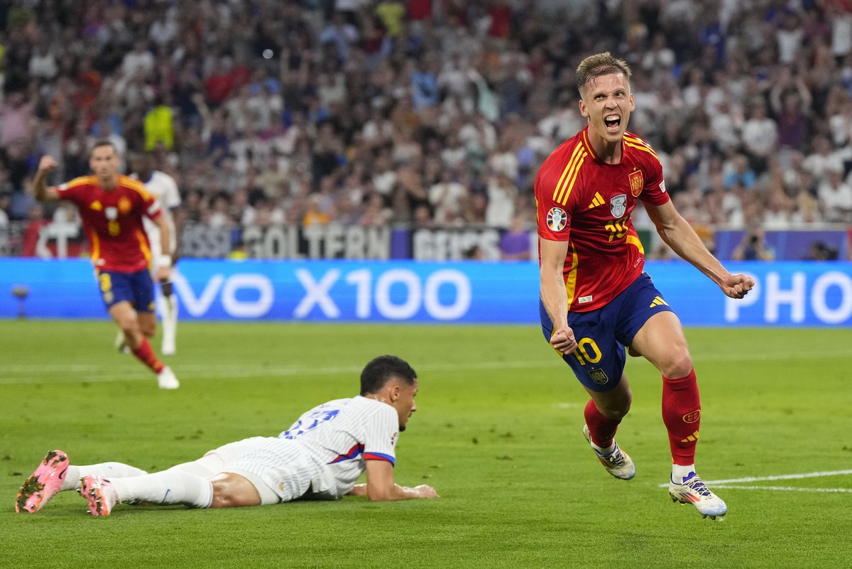 Spain's Dani Olmo celebrates after scoring his side's second goal during a semifinal match between Spain and France at the Euro 2024 soccer tournament in Munich, Germany, Tuesday, July 9, 20 ...