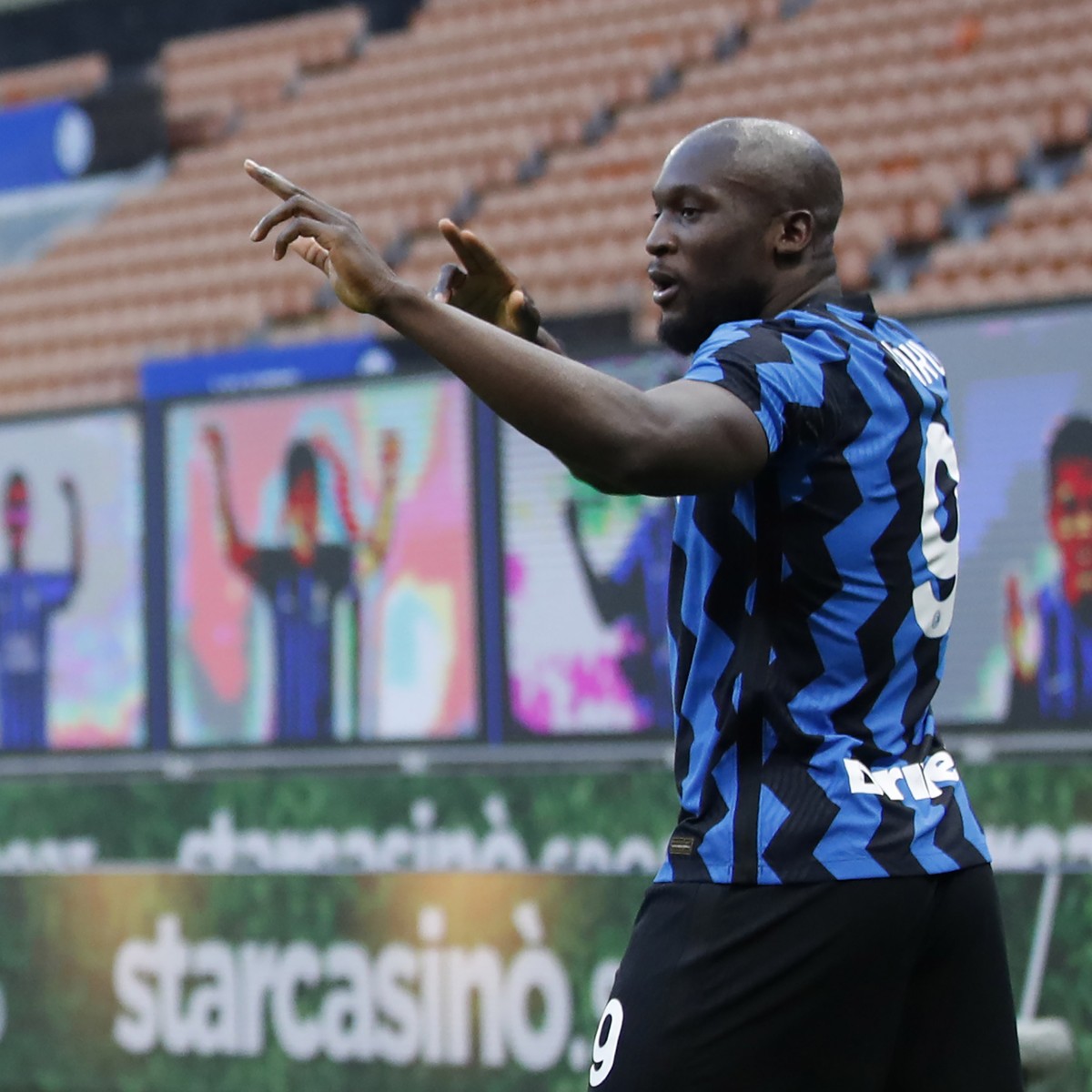 Inter Milan's Romelu Lukaku, right, celebrates with his teammate Lautaro Martinez after scores against Sassuolo during the Serie A soccer match between Inter Milan and Sassuolo at the San Siro St ...