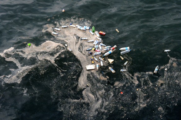 epa06769424 Empty plastic bottles and floating trash are seen in the coastline of the Mediterranean Sea in Beirut, Lebanon, 28 May 2018. EPA/WAEL HAMZEH