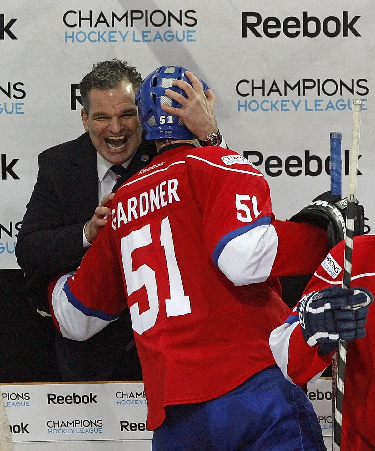 ZSC Lions head coach Sean Simpson, left, hugs forward Ryan Gardner after ZSC's victory in the ice hockey Champions League second leg final game between ZSC Lions of Switzerland and Metallurg Magn ...