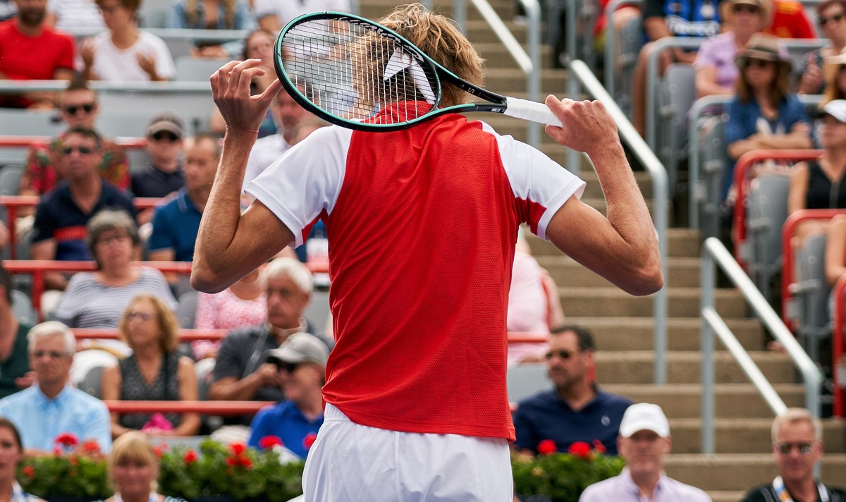epa07765024 Alexander Zverev of Germany walking back after he lost a point against Karen Khachanov of Russia during the Men's Singles quarter-final at the Rogers Cup tennis tournament in Montreal ...