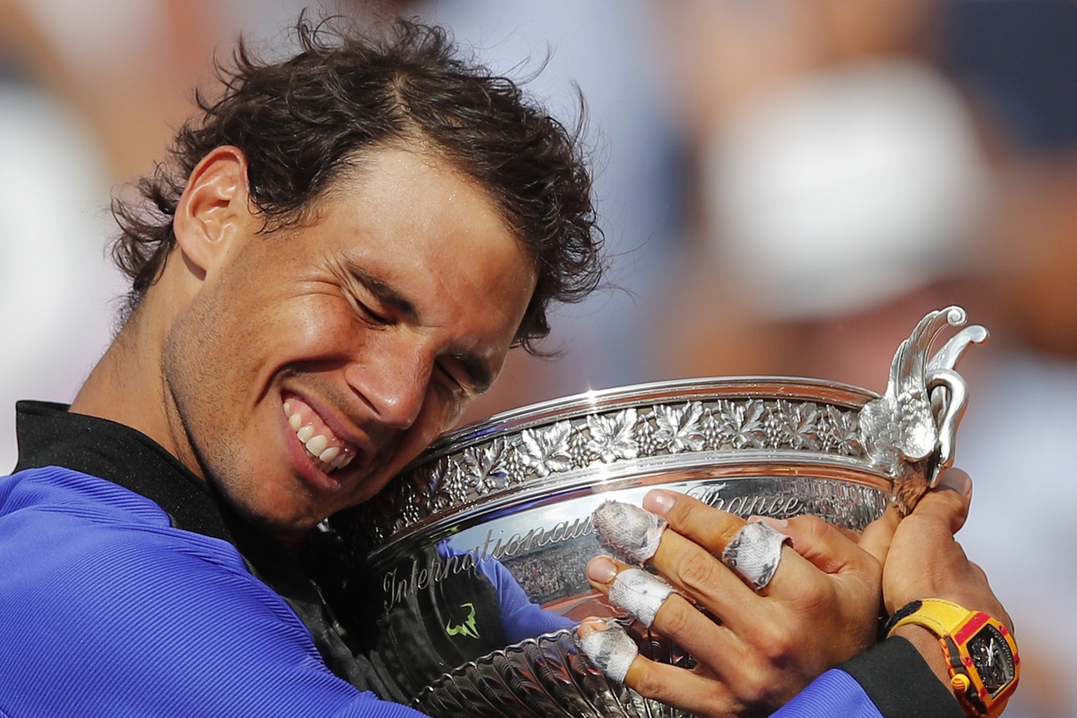 Spain&#039;s Rafael Nadal holds the trophy as he celebrates winning his tenth French Open title against Switzerland&#039;s Stan Wawrinka in three sets, 6-2, 6-3, 6-1, during their men&#039;s final mat ...