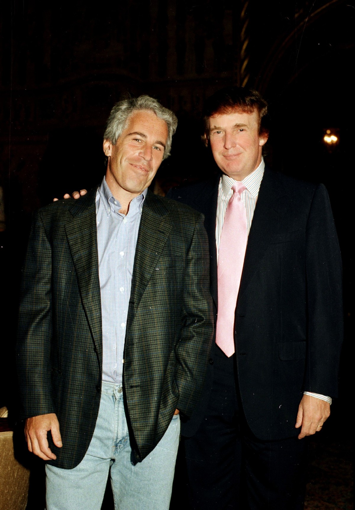 Portrait of American financier Jeffrey Epstein (left) and real estate developer Donald Trump as they pose together at the Mar-a-Lago estate, Palm Beach, Florida, 1997.(Photo by Davidoff Studios/Getty  ...
