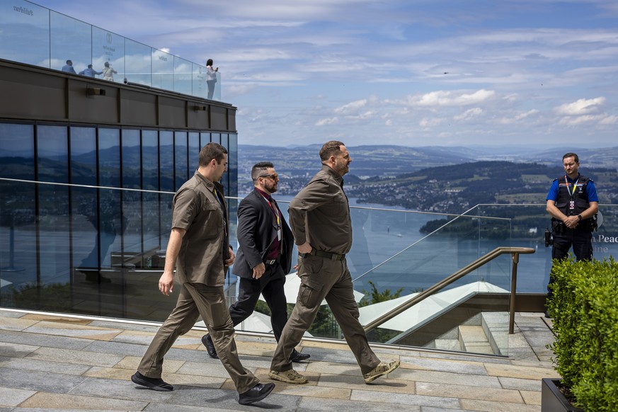 epa11415705 Ukraine&#039;s Head of the presidential Office of Ukraine Andriy Yermak (C) makes his way with security and police during the Summit on Peace in Ukraine in Stansstad near Lucerne, Switzerl ...