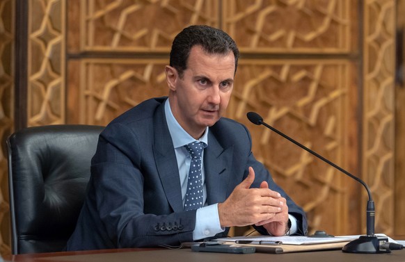 epa07134053 A handout photo made available by Syria&#039;s Arab News Agency (SANA) shows Syrian President Bashar al-Assad speaking during a meeting with delegations of the Executive Committee of the W ...