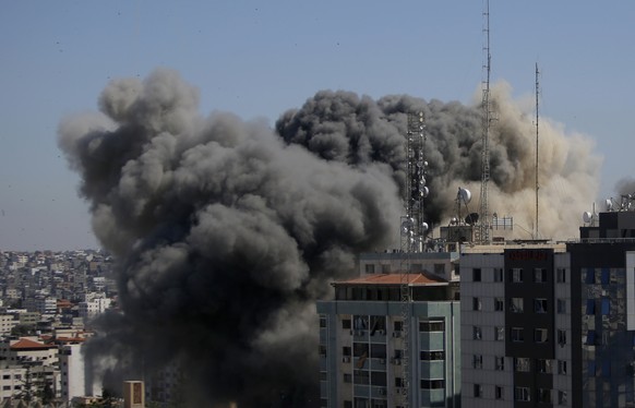 A view of a 11-story building housing AP office and other media in Gaza City is seen moments after Israeli warplanes demolished it, Saturday, May 15, 2021. (AP Photo/Hatem Moussa)
