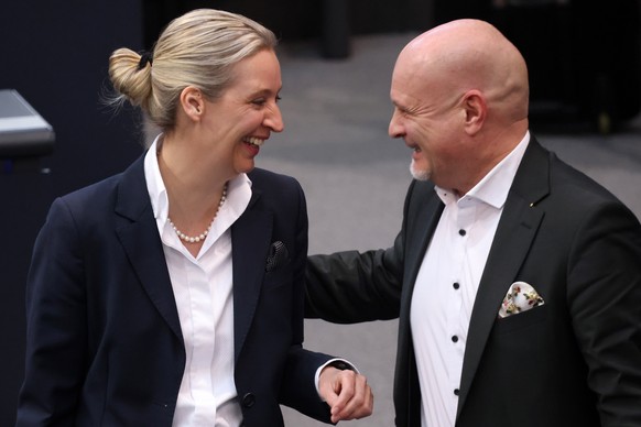 epa11085166 Alternative for Germany party (AfD) parliamentarian party manager, Enrico Komning (R), and Alternative for Germany party (AfD) party and faction co-chairwoman, Alice Weidel (L), arrive for ...