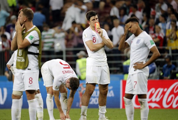 epa06882036 Harry Maguire of England (2R) and teammates react after the FIFA World Cup 2018 semi final soccer match between Croatia and England in Moscow, Russia, 11 July 2018.

(RESTRICTIONS APPLY: ...