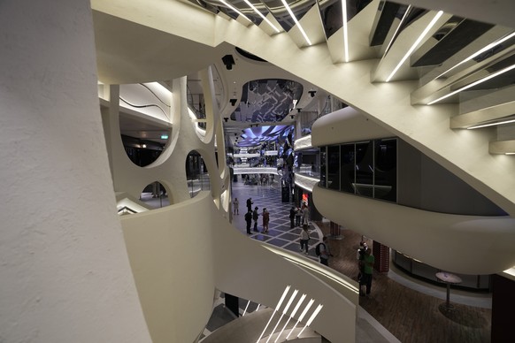 People walk inside the 22-decks cruise ship MSC World Europa, a floating hotel docked at Doha Port to offer accommodate for around 6,700 World Cup fans, in Doha, Qatar, Sunday, Nov. 13, 2022. Final pr ...