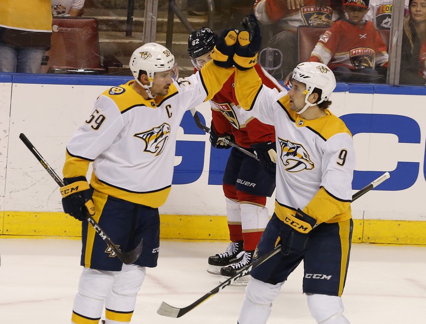 Nashville Predators defenseman Roman Josi (59) reacts with teammate Filip Forsberg after Josi&#039;s goal in the third period of play against the Florida Panthers in an NHL hockey game, Friday Feb. 1, ...