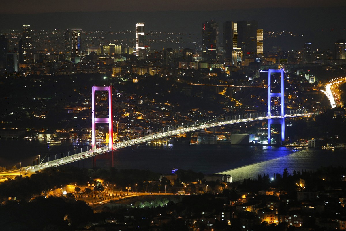 FILE - In this Friday July 15, 2016 file photo, Istanbul's iconic Bosporus Bridge is lit in the colours of the French flag in solidarity with the victims of the attack in Nice, France, a few hour ...