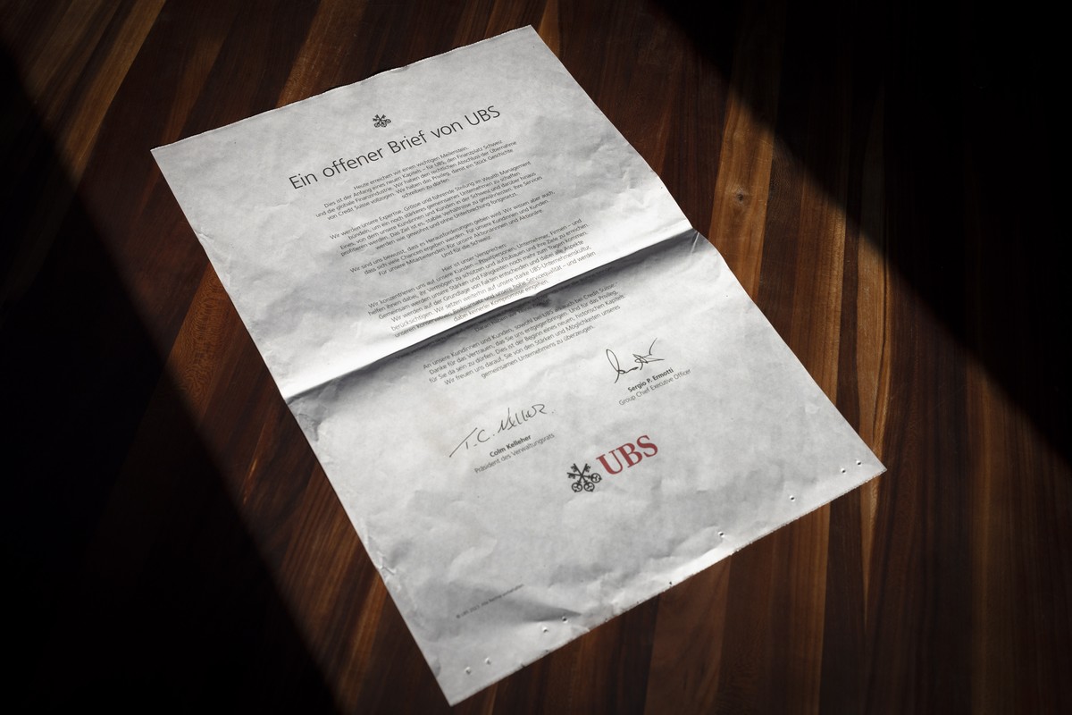 epa10686359 An open letter from Swiss bank UBS included with a daily newspaper is pictured in Zurich, Switzerland, 12 June 2023. "UBS has completed the legal closing of its acquisition of Credit  ...