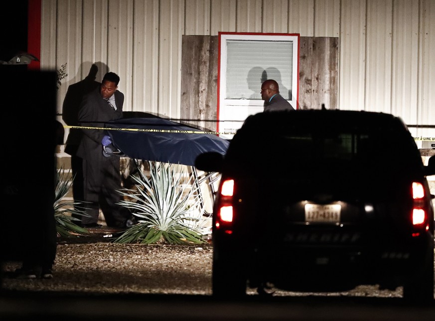 epa07952934 Bodies are removed from the Party Venue after a shooting in Greenville, Texas, USA, 27 October 2019. According to reports, two people have been killed and several injured in a mass shootin ...