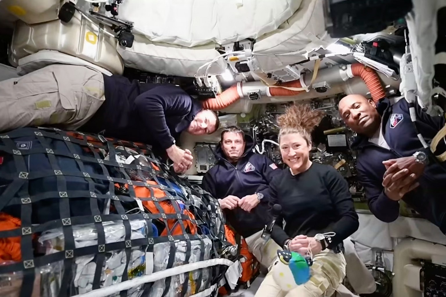 This image taken from video provided by NASA shows the Artemis II crew, from left, Canadien astronaut and mission specialist Jeremy Hansen, Commander Reid Wiseman, mission specialist Christina Koch an ...