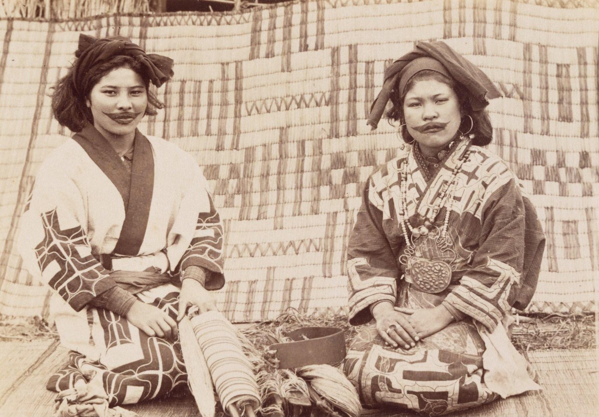 Two Ainu women with lip tattoos. Japan, 1890. Photo by Tamoto Kenzō.