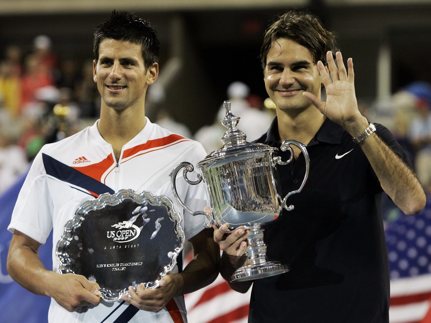 Novak Djokovic, left, of Serbia poses with Roger Federer of Switzerland after Federer won the men&#039;s finals at the US Open tennis tournament in New York, Sunday, Sept. 9, 2007.(AP Photo/Elise Amen ...