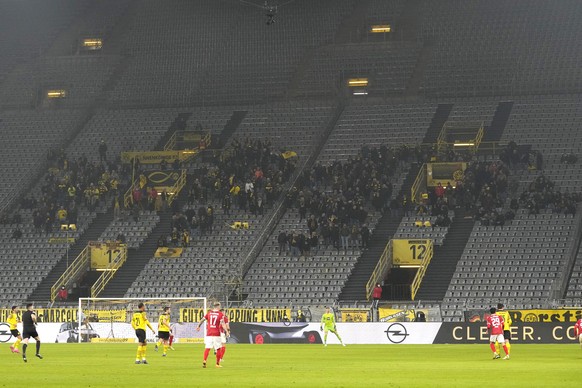 The seven hundred fifty fans of Dortmund are seen during the German Bundesliga soccer match between Borussia Dortmund and SC Freiburg in Dortmund, Germany, Friday, Jan. 14, 2022. (AP Photo/Martin Meis ...