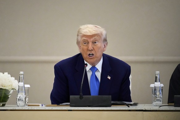 President Donald Trump attends a business meeting and roundtable at Qasr Al Watan, in Abu Dhabi, United Arab Emirates Friday, May 16, 2025. (AP Photo/Altaf Qadri)
Trump Mideast
