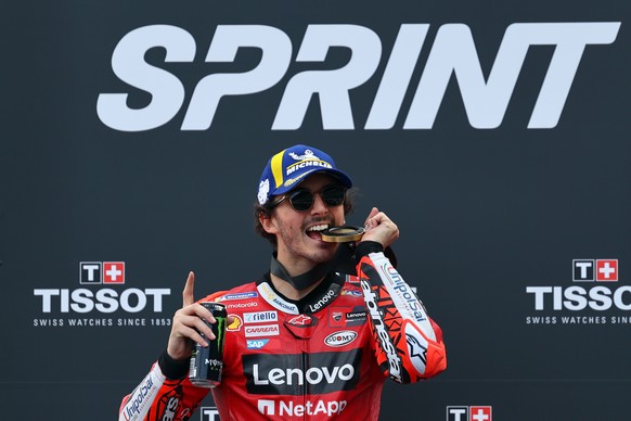 epa10542788 Italian MotoGP rider Francesco Bagnaia of Ducati Lenovo Team celebrates after winning the sprint race at Algarve International race track, Portimao, Portugal, 25 March 2023. The Motorcycli ...