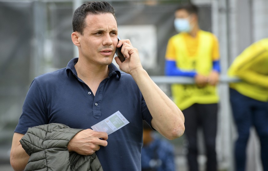 Basel&#039;s director of the board David Degen speaks on his mobile phone during a friendly soccer match as part of the Festival de Football des Alpes between FC Basel 1893 of Switzerland and FC Dynam ...