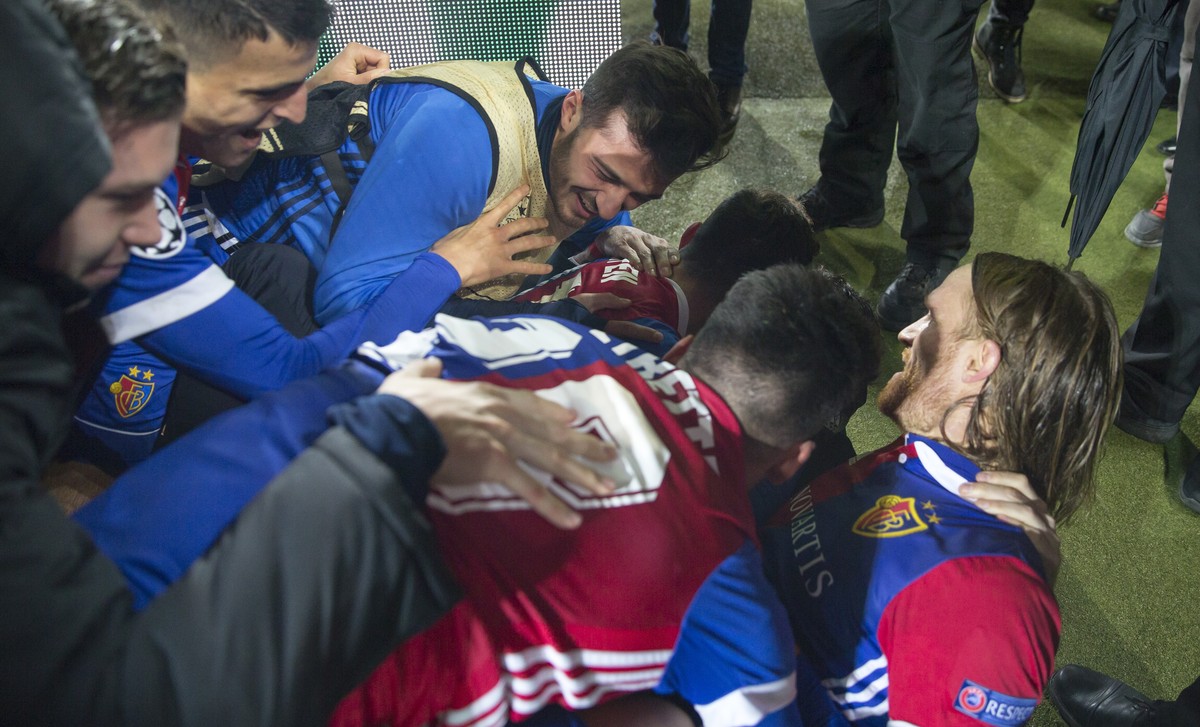 Players of the FC Basel celebrate with Basel's Michael Lang, right, the first goal during the UEFA Champions League Group stage Group A matchday 5 soccer match between Switzerland's FC Basel ...