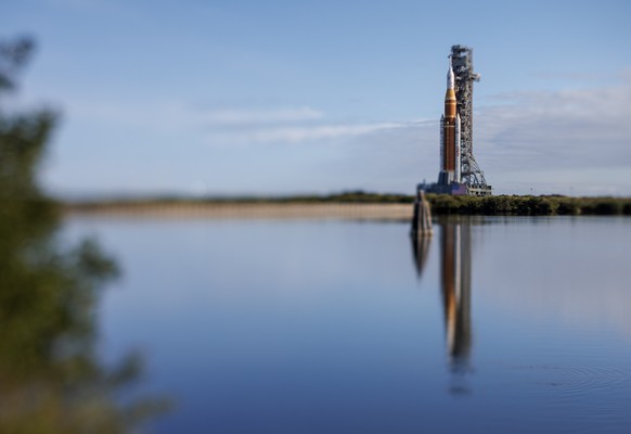 epaselect epa12655846 The SLS rocket with an Orion capsule, part of the Artemis 2 mission, is being transported from the NASA's Vehicle Assembly Building to pad 39B at Kennedy Space Center in Tit ...