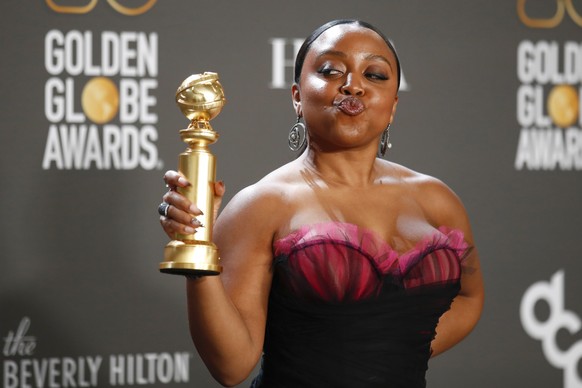 epa10399289 American writer and actor Quinta Brunson poses with the award for Best Performance by an Actress in a Television Musical or Comedy Series in the press room during the 80th Annual Golden Globe Aw...