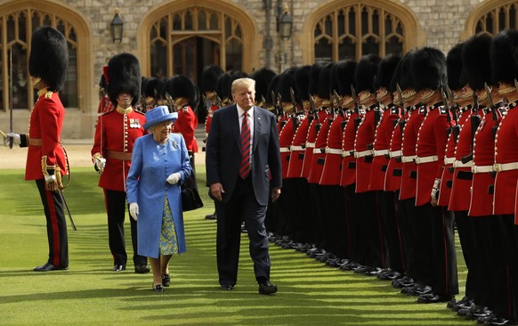 FILE - U.S. President Donald Trump and Britain&#039;s Queen Elizabeth II inspect a Guard of Honour, formed of the Coldstream Guards at Windsor Castle in Windsor, England, July 13, 2018.(AP Photo/Matt  ...