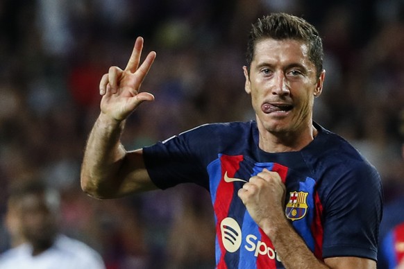 Barcelona&#039;s Robert Lewandowski celebrates after scoring his side&#039;s fourth goal during a Group C Champions League soccer match between FC Barcelona and Viktoria Plzen at the Camp Nou stadium  ...