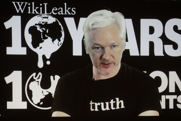 FILE - In this Oct. 4, 2016 file photo, WikiLeaks founder Julian Assange participates via video link at a news conference marking the 10th anniversary of the secrecy-spilling group in Berlin. WikiLeak ...
