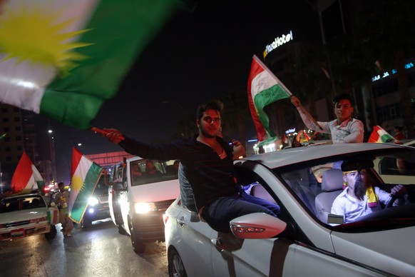epa06227201 Kurdish people celebrate in streets after the Kurdistan independence referendum in Erbil northern Iraq, 25 September 2017. The Kurdistan region is an autonomous region in northern Iraq sin ...