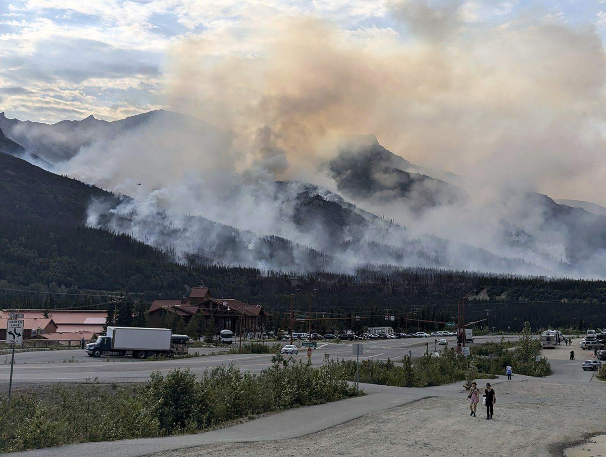 This photo provided by the National Park Service shows a wildfire burning about a mile north of Denali National Park and Preserve, Alaska, on June 30, 2024, as seen from a tourist area outside the par ...