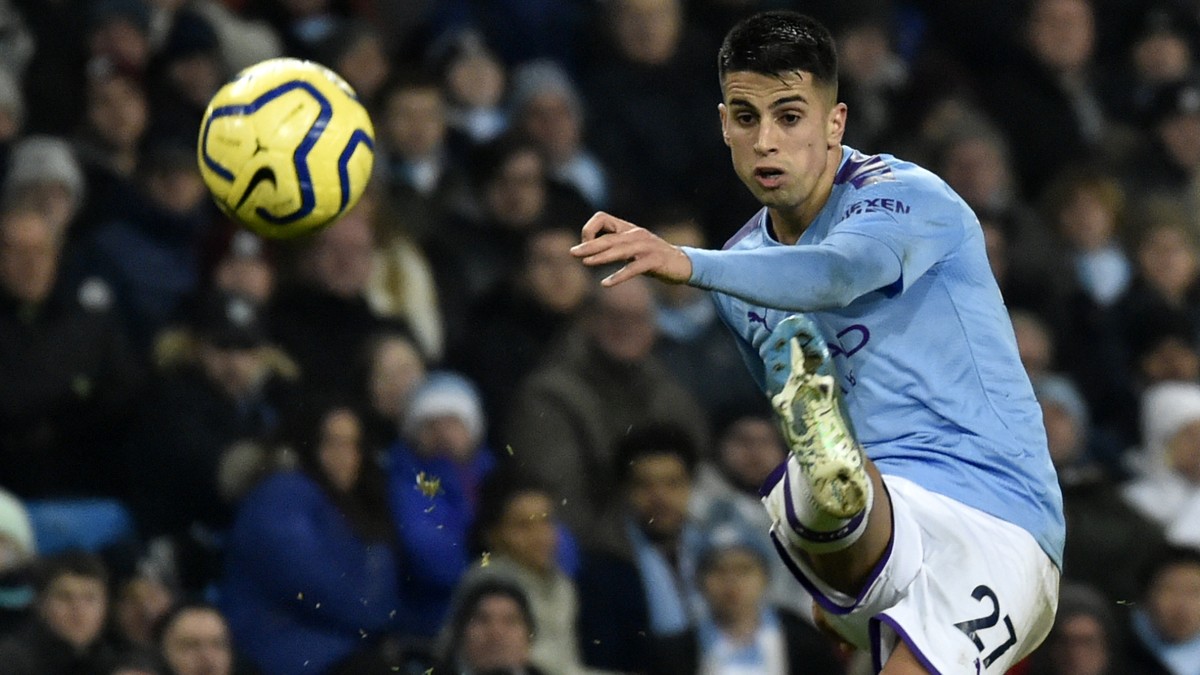 Manchester City's Joao Cancelo kicks the ball during the English Premier League soccer match between Manchester City and Everton at Etihad stadium in Manchester, England, Wednesday, Jan. 1, 2020. ...