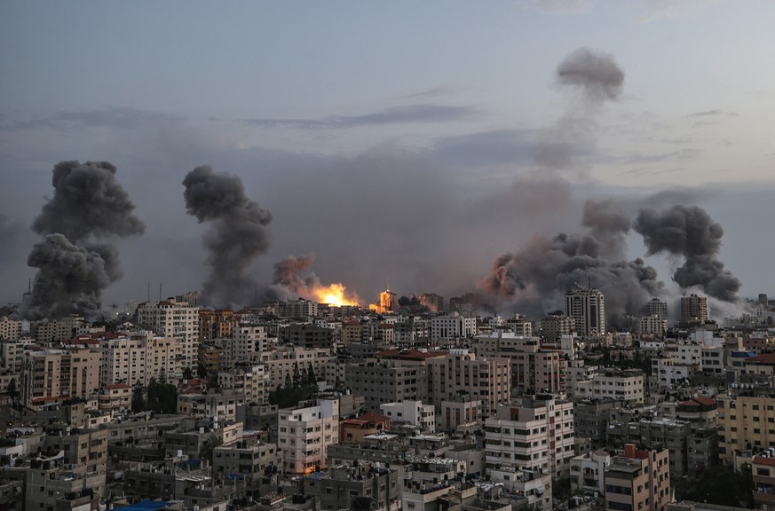 epaselect epa10910407 Smoke rises following an Israeli air strike on Gaza City, 09 October 2023. More than 700 Israelis were killed and over 2,000 were injured since the Islamist movement Hamas carrie ...