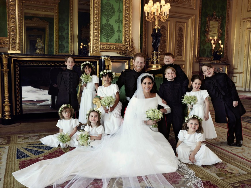 epa06754361 A handout photo made available by Kensington Palace on 21 May 2018 of the official wedding photograph released by the Duke and Duchess of Sussex showing Britain&#039;s Prince Harry, Duke o ...