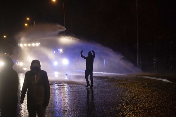 epa09123328 A General view of Nationalist youths clashing with Police on the Springfield Road in west Belfast, in Northern Ireland, Britain, 08 April 2021. Protests have been taking place across North ...