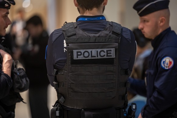 epa12887356 French Police forces secure the entrance of the Paris Courthouse, during the closing day of the trial of the Lafarge company former executives, accused of financing terrorism in Syria in P ...