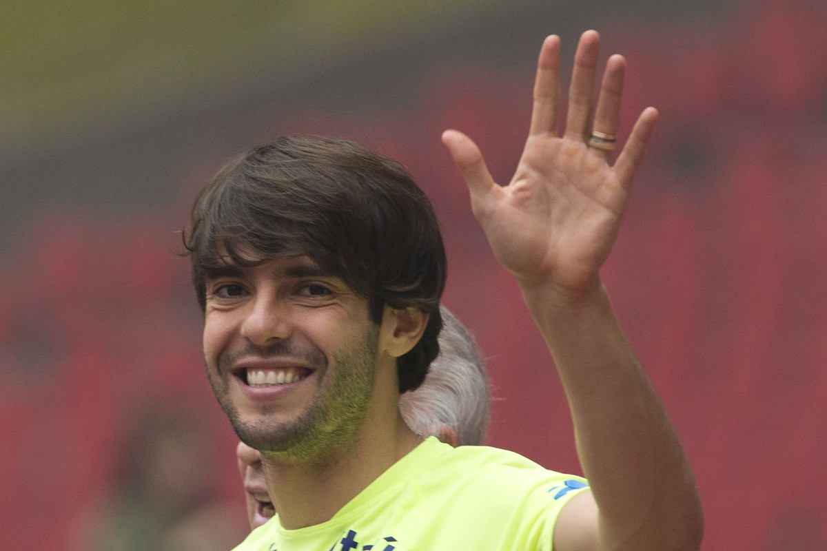 FILE-In this Friday, Oct. 10, 2014 file photo, Brazil's Kaka waves as he arrives for a training session ahead of a friendly match against Argentina at the Bird's Nest National Stadium in Bei ...