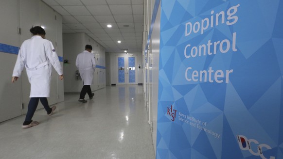 Researches enter into the Doping Control Center at the Korea Institute of Science and Technology in Seoul, South Korea, Monday, Feb. 19, 2018. Russia could lose its chance to be reinstated before the  ...