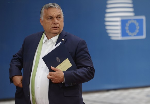 FILE - In this Friday, June 25, 2011 file photo, Hungarian Prime Minister Viktor Orban leaves at the end of an EU summit at the European Council building in Brussels. Hungary