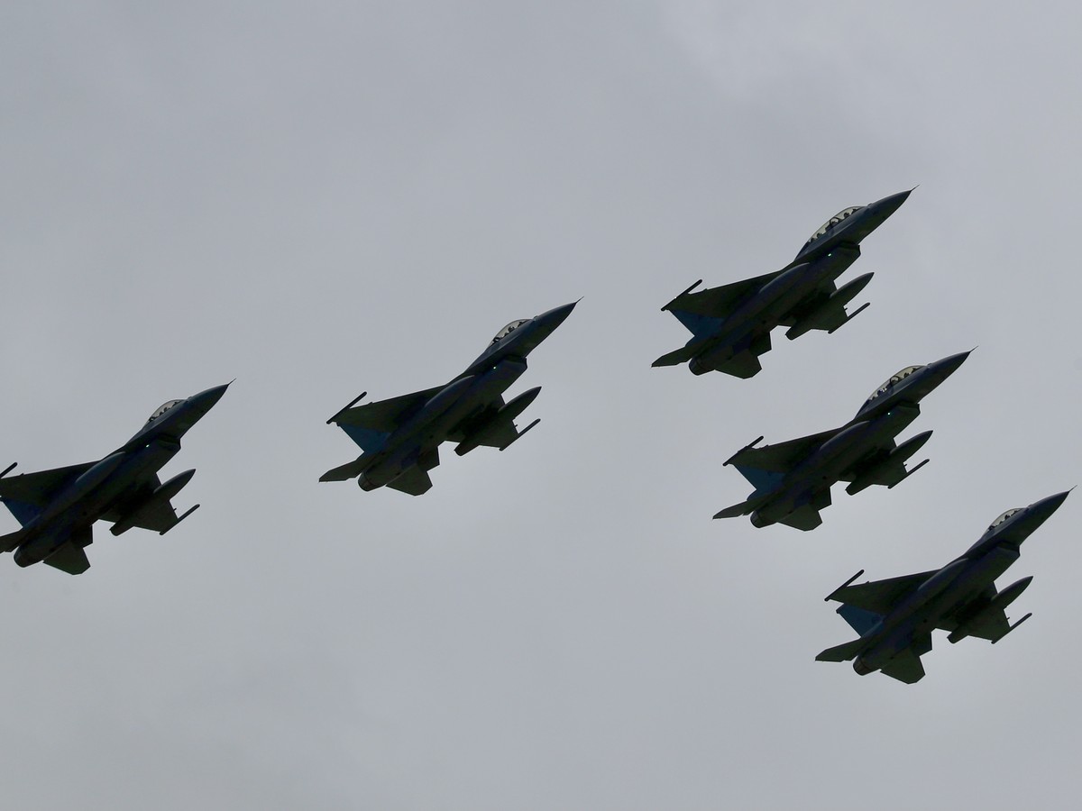 epa09516102 Taiwan domestically-built Indigenous Defense Fighters (IDF) fly over during National Day celebrations in Taipei, Taiwan, 10 October 2021. Amidst growing tension between China and Taiwan, T ...