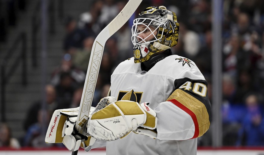 Vegas Golden Knights goaltender Akira Schmid (40) looks on during a pause in play in the first period of an NHL hockey game against the Colorado Avalanche Tuesday, April 8, 2025, in Denver. (AP Photo/ ...