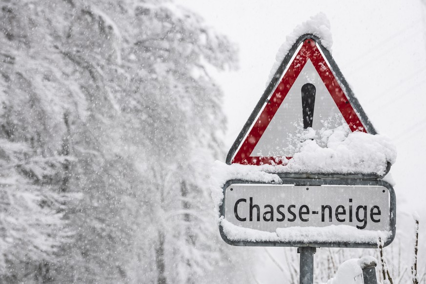 epa07484657 A road sign covered in snow in Saint-Legier, Switzerland, 04 April 2019. Reports state that a wintry outlook across many parts of Europe as a cold front brings snow, to many areas. EPA/ADR ...