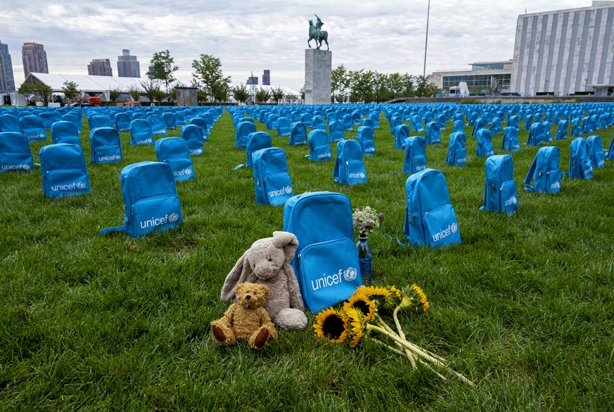 Thousands of school backpacks are laid out in an installation on the North Lawn of the United Nations Sunday, Sept. 8, 2019. The installation, created by UNICEF, illustrates the scale of child deaths ...