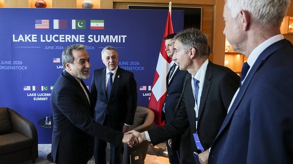 Switzerland Iran-US Talks June 2026 Iranian Foreign Minister Abbas Araghchi shakes hands with a Swiss official during a meeting at the Burgenstock resort in Obburgen, near Lucerne, Switzerland, on Jun ...